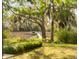 Scenic view of private dock and boat slip amidst lush greenery and Spanish moss-draped trees at 333 W Confederate Cir, Charleston, SC 29407