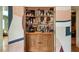 Custom bar displaying liquor, glassware, and featuring decorative doors at 333 W Confederate Cir, Charleston, SC 29407