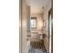 Charming bathroom featuring a pedestal sink, tiled walls, and black and white checkerboard flooring at 333 W Confederate Cir, Charleston, SC 29407
