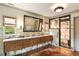 Luxurious bathroom with marble countertops, custom cabinetry, and a sleek glass-enclosed shower at 333 W Confederate Cir, Charleston, SC 29407