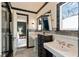 Beautiful bathroom with tiled walls, pedestal sinks, and a view into an adjacent bedroom at 333 W Confederate Cir, Charleston, SC 29407