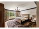 Bright bedroom with large windows, hardwood floors, stylish furniture, and scenic outdoor views at 333 W Confederate Cir, Charleston, SC 29407