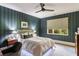 Stylish bedroom featuring elegant bed, patterned wallpaper, modern ceiling fan, and natural light at 333 W Confederate Cir, Charleston, SC 29407