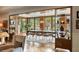 Dining room with large windows offering beautiful outdoor views, adjacent to the living area at 333 W Confederate Cir, Charleston, SC 29407
