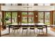 Dining room with large wood-framed windows offering scenic views of the lush landscape at 333 W Confederate Cir, Charleston, SC 29407