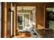 Bright dining area with outdoor access, wood-paneled walls and open views of the outdoor patio at 333 W Confederate Cir, Charleston, SC 29407