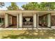 Inviting exterior with large, open glass doors leading to a spacious dining and sitting area at 333 W Confederate Cir, Charleston, SC 29407