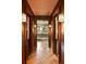 Sophisticated hallway with wood accents, herringbone floors, and a glimpse into a beautifully appointed kitchen at 333 W Confederate Cir, Charleston, SC 29407