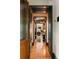 Inviting hallway with hardwood floors and detailed trim, leading to bright, stylish living spaces at 333 W Confederate Cir, Charleston, SC 29407