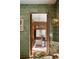 Hallway view into a dining room, featuring wood paneling, designer credenza and bold wall paint at 333 W Confederate Cir, Charleston, SC 29407