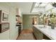 View of kitchen showing marble island, modern stove, and green tiled wall accent at 333 W Confederate Cir, Charleston, SC 29407