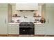 A modern range with marble backsplash in the kitchen with ample counter and cabinet space at 333 W Confederate Cir, Charleston, SC 29407
