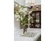 Marble kitchen island with brass faucet, sink, and floral arrangement centerpiece at 333 W Confederate Cir, Charleston, SC 29407
