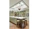 Charming kitchen featuring skylights, marble island, stylish pendant lights, and breakfast bar seating at 333 W Confederate Cir, Charleston, SC 29407