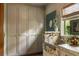Laundry room featuring marble sink, storage cabinets and a garden view window at 333 W Confederate Cir, Charleston, SC 29407