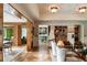 Open concept living room showcasing herringbone hardwood floors, and seamless transition to the bar and dining areas at 333 W Confederate Cir, Charleston, SC 29407