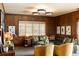Stylish living room featuring wood paneling, modern lighting, and comfortable seating at 333 W Confederate Cir, Charleston, SC 29407