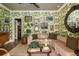 Charming living room with unique wallpaper, cozy seating, and natural light creating a warm, inviting atmosphere at 333 W Confederate Cir, Charleston, SC 29407