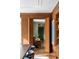 Open doorway reveals living space with wood paneled walls and herringbone wood floors at 333 W Confederate Cir, Charleston, SC 29407