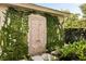 An outdoor shower is nestled against a wall covered with climbing vines, providing a refreshing and private bathing experience at 333 W Confederate Cir, Charleston, SC 29407