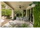 Covered patio with comfortable seating and serene garden views, perfect for outdoor relaxation at 333 W Confederate Cir, Charleston, SC 29407