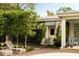 Relaxing poolside retreat with lounge chairs, lush landscaping, and charming architecture with striped awning accents at 333 W Confederate Cir, Charleston, SC 29407