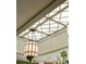 A close up of the kitchen's grid patterned skylight and pendant lighting fixture at 333 W Confederate Cir, Charleston, SC 29407