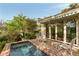 A refreshing splash pool offers a relaxing outdoor retreat with lounge chairs, surrounded by greenery, next to the house at 333 W Confederate Cir, Charleston, SC 29407