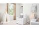 Neutral bedroom with large window, teepee, accent chair, and a decorative blanket ladder at 339 Pine Crest View Dr, Summerville, SC 29486