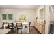 Bright dining room with a modern table, sleek chairs, and an attractive accent cabinet for ample storage at 339 Pine Crest View Dr, Summerville, SC 29486