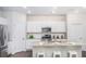Modern kitchen with white cabinets, stainless steel appliances, and granite countertops at 339 Pine Crest View Dr, Summerville, SC 29486