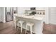 Modern kitchen featuring granite countertops, stainless steel appliances, and a center island with bar stools at 339 Pine Crest View Dr, Summerville, SC 29486