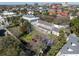 A neighborhood aerial shot featuring beautiful homes and buildings nestled among lush trees at 34 Smith St, Charleston, SC 29401