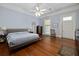 Large primary bedroom with hardwood floors and ample natural light and a ceiling fan at 34 Smith St, Charleston, SC 29401