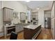 Bright kitchen featuring an island with granite countertop, gray cabinets, and stainless steel appliances at 34 Smith St, Charleston, SC 29401