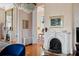 Refined living space showcasing a fireplace, elegant chandelier, and vintage decor at 34 Smith St, Charleston, SC 29401