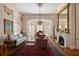 Elegant living room with a fireplace, chandelier, large windows and refined decor at 34 Smith St, Charleston, SC 29401