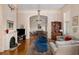 A grand living room boasts fireplace, chandelier, and a view into the dining area at 34 Smith St, Charleston, SC 29401