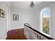 Staircase landing with a large window and hardwood floors allowing natural light at 34 Smith St, Charleston, SC 29401