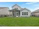 Beautiful backyard featuring a screened-in porch and well-maintained lawn provides a relaxing atmosphere at 3438 Great Egret Dr, Johns Island, SC 29455
