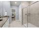 Tiled bathroom features double vanity, a glass-enclosed shower, and an ensuite bedroom at 3438 Great Egret Dr, Johns Island, SC 29455