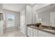 Bright bathroom featuring a double sink vanity with granite countertop and tile floor at 3438 Great Egret Dr, Johns Island, SC 29455