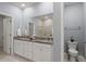 Bright bathroom with double vanity, granite countertop, and a glass-enclosed shower at 3438 Great Egret Dr, Johns Island, SC 29455