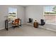 Bedroom offers natural light, neutral paint, and plush carpet with a desk and chairs at 3438 Great Egret Dr, Johns Island, SC 29455