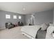 Spacious primary bedroom featuring neutral paint and three windows for natural light at 3438 Great Egret Dr, Johns Island, SC 29455