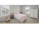 Bright bedroom featuring neutral paint, carpet, and two windows for natural light at 3438 Great Egret Dr, Johns Island, SC 29455