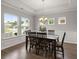 Dining room featuring hardwood floors, a large table, and natural light from multiple windows at 3438 Great Egret Dr, Johns Island, SC 29455