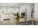 Kitchen with granite countertops and stainless steel sink offer seamless flow into the living room at 3438 Great Egret Dr, Johns Island, SC 29455