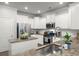 Bright kitchen boasts stainless appliances, white cabinets, subway tile backsplash, and granite countertops at 3438 Great Egret Dr, Johns Island, SC 29455
