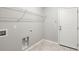 Utility room with washer/dryer hookups, shelving, and a convenient access door at 3438 Great Egret Dr, Johns Island, SC 29455